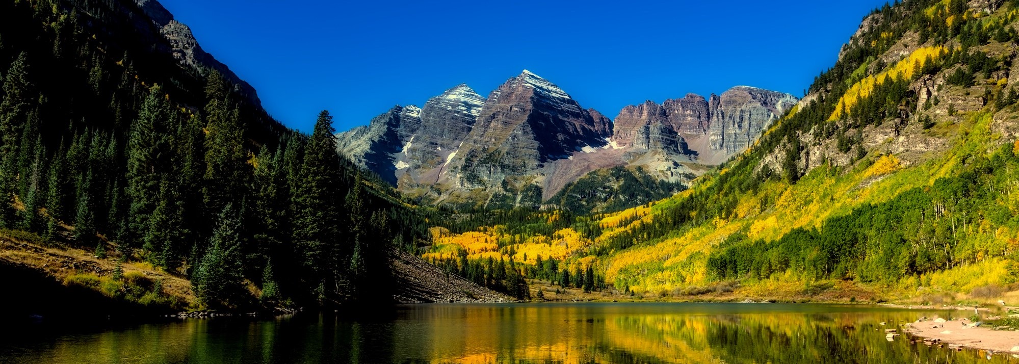 Looking at the mountains from a pond